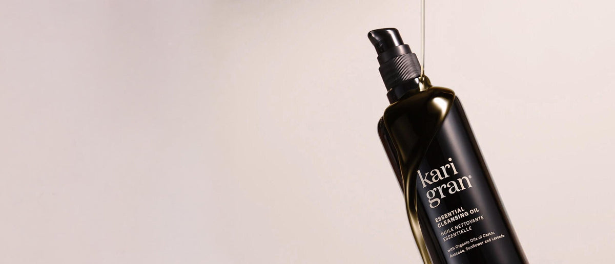 kari gran essential serum balm with swipes of product next to the jar