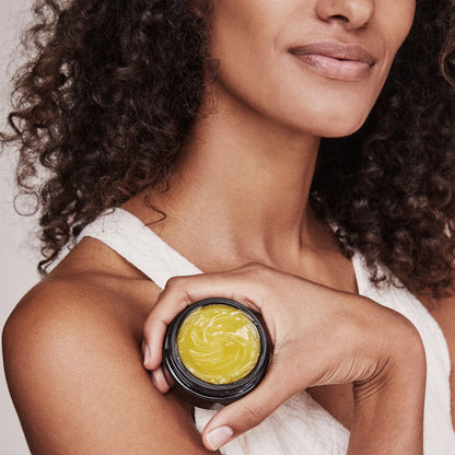 model holds essentials serum balm